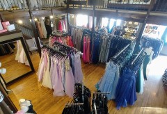 Dresses in many colors including purple, blue, pink, and yellow